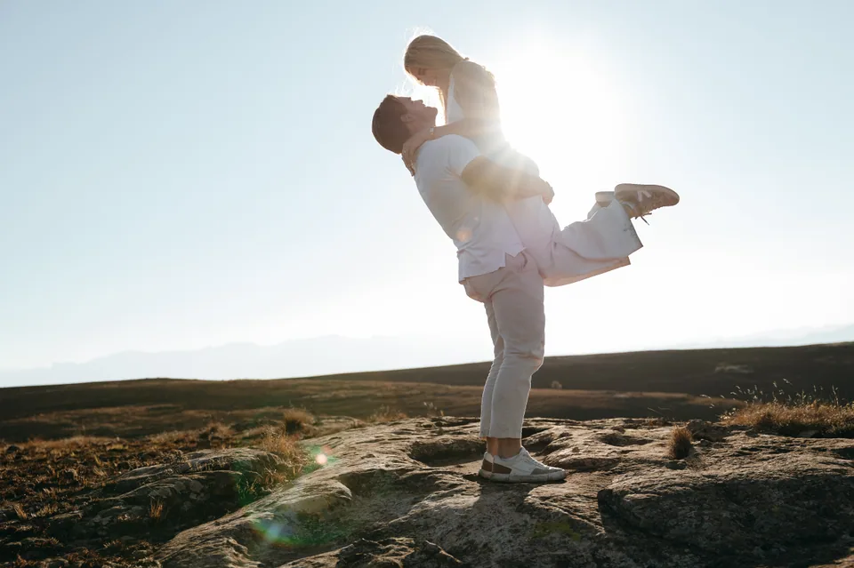 Joshua lifting Christy against the sun
