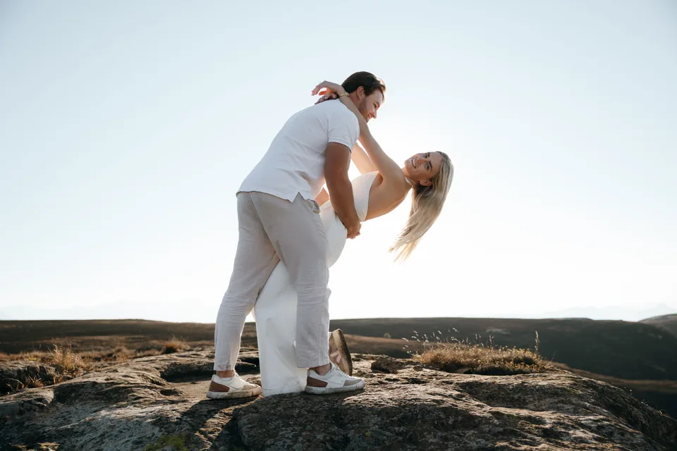 A dip and a kiss on the rocks