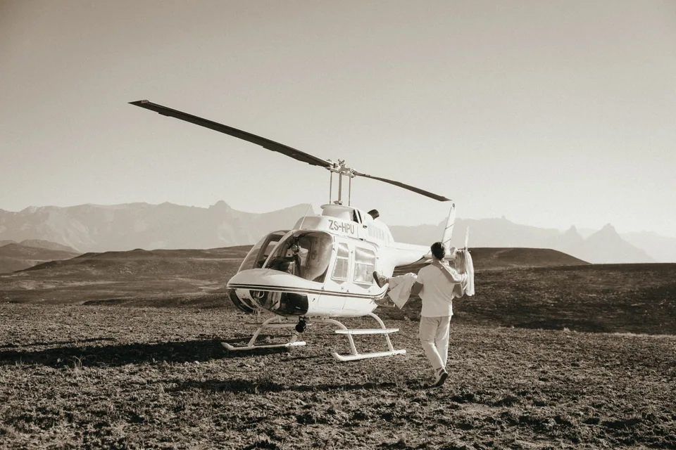 The helicopter on the escarpment, the two of them beside it