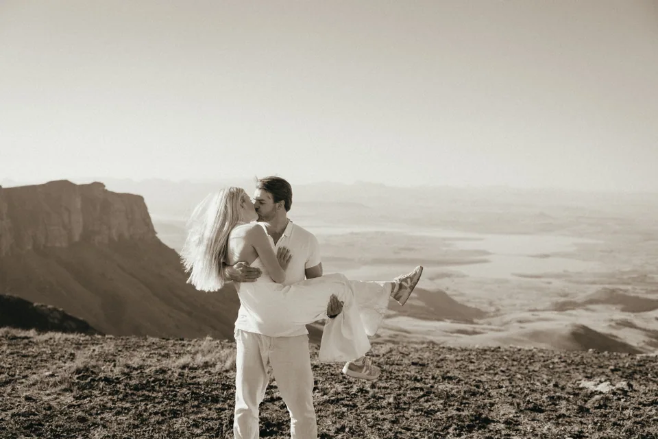 Joshua lifting Christy at the escarpment edge